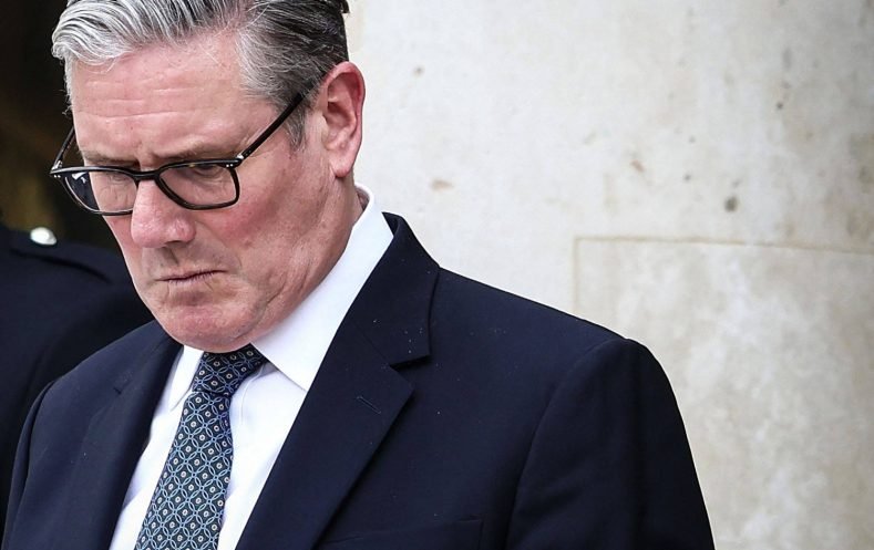 (FILES) Britain's Prime Minister Keir Starmer reacts as he prepares to leave the Elysee Presidential Palace in Paris on April 17, 2026. British Prime Minister Keir Starmer promised on May 9, 2026, he would "listen to voters" after his Labour party received a historic drubbing in local and regional elections. (Photo by Tom Nicholson / POOL / AFP)